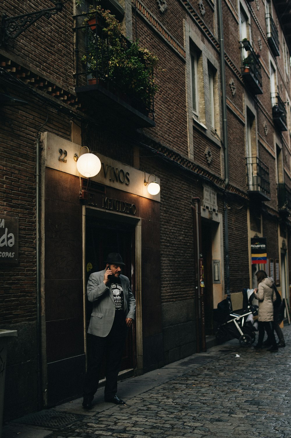 man standing beside door