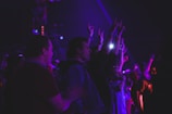 A group of people enjoying a live performance at an event.