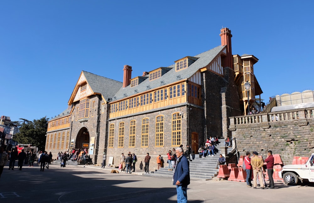 people near buildings under blue sky