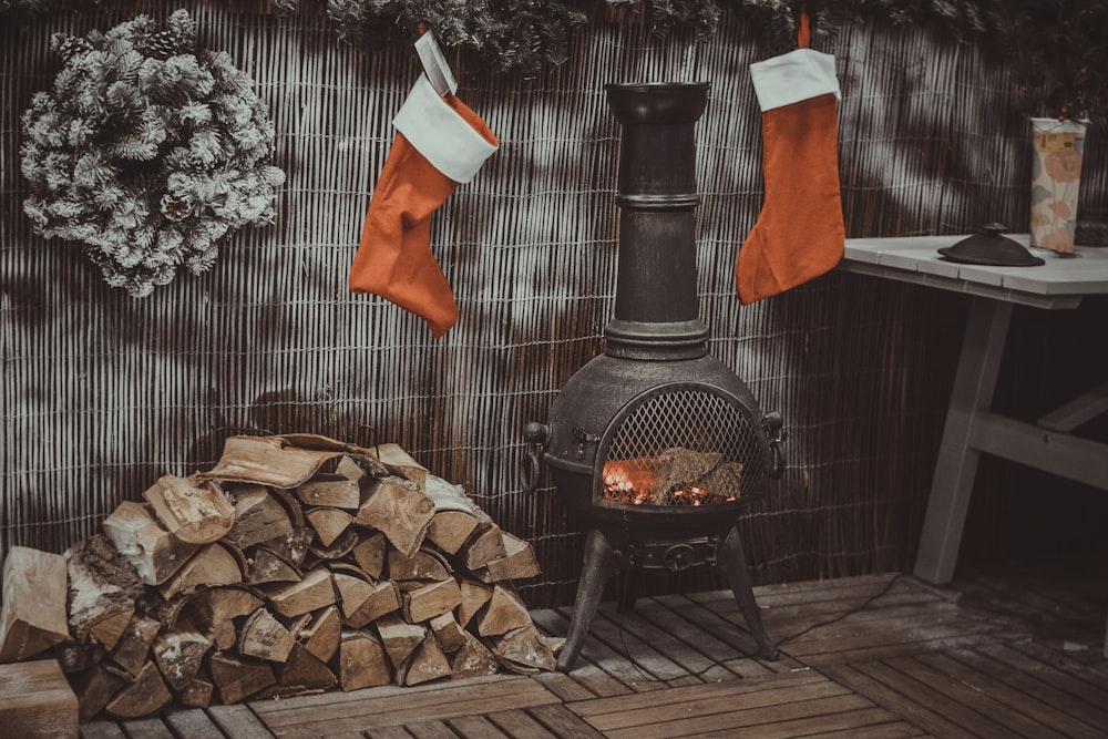 firewood in black chiminea