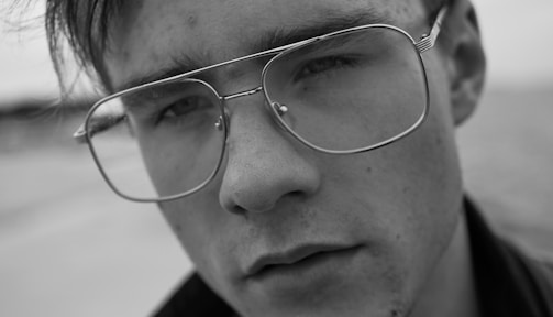 Close-up of a vintage tintype portrait showing intricate facial details and antique textures.