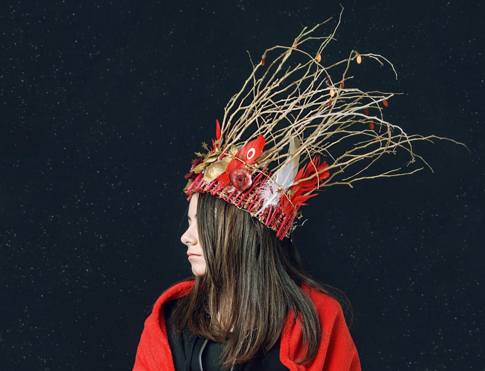 woman wearing red and white feather crown