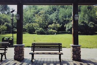 Wide shot of a public park featuring recycled material benches and pathways