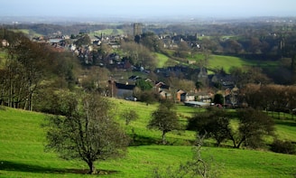 A scenic view of a Serbian landscape with rolling hills and a historic village.