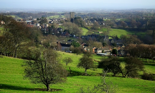 A scenic view of a Serbian landscape with rolling hills and a historic village.