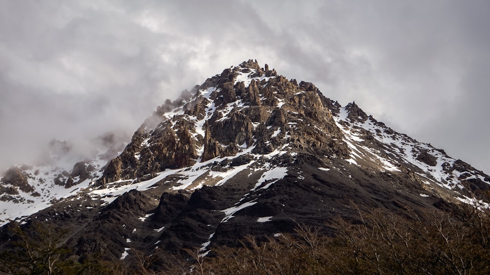 low-angle photography of mountain covered with snow