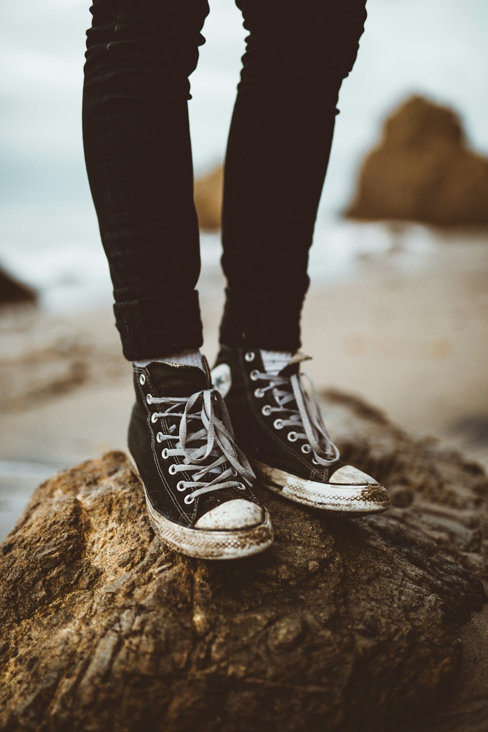 selective focus photography of high-top sneakers