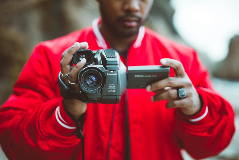 man holding camcorder