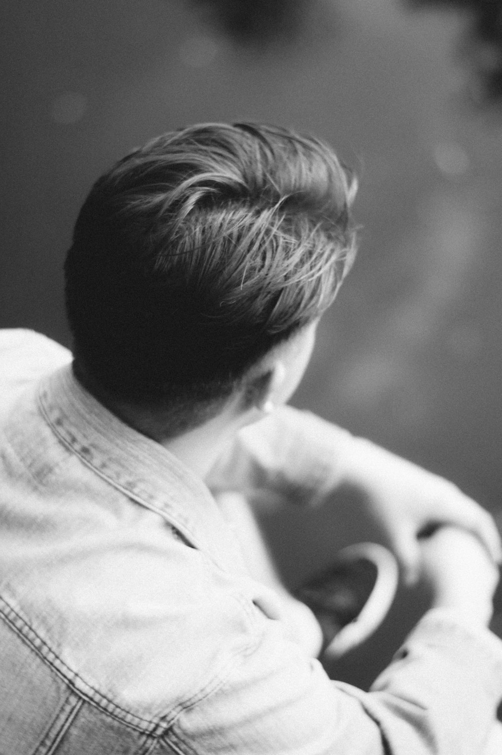 man wearing denim jacket