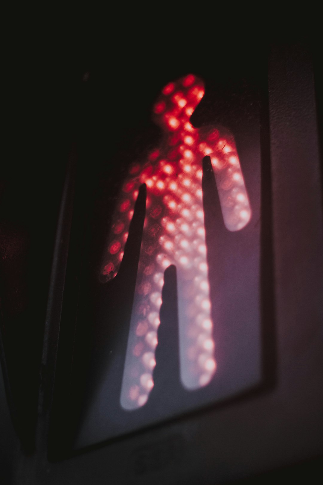 selective focus photography of pedestrian light turned-on