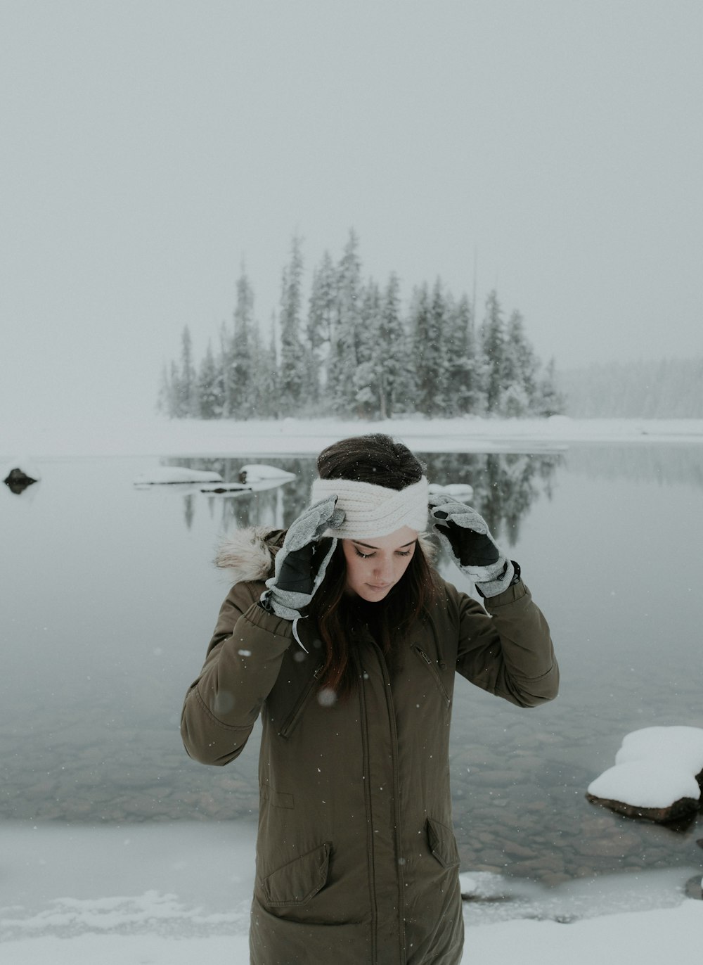 woman standing near body of water during daytime