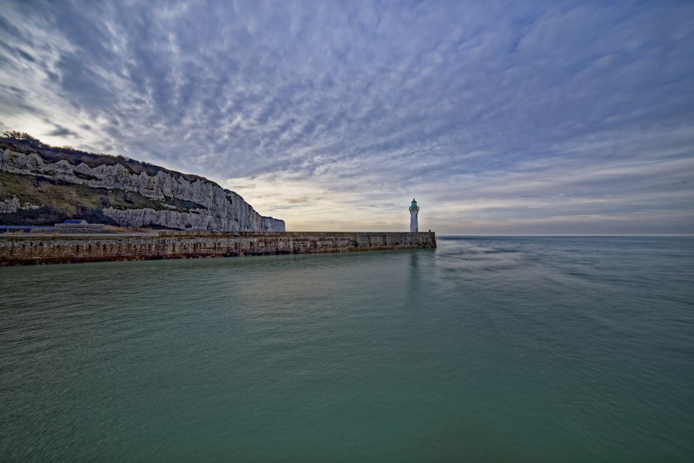 lighthouse beside sea