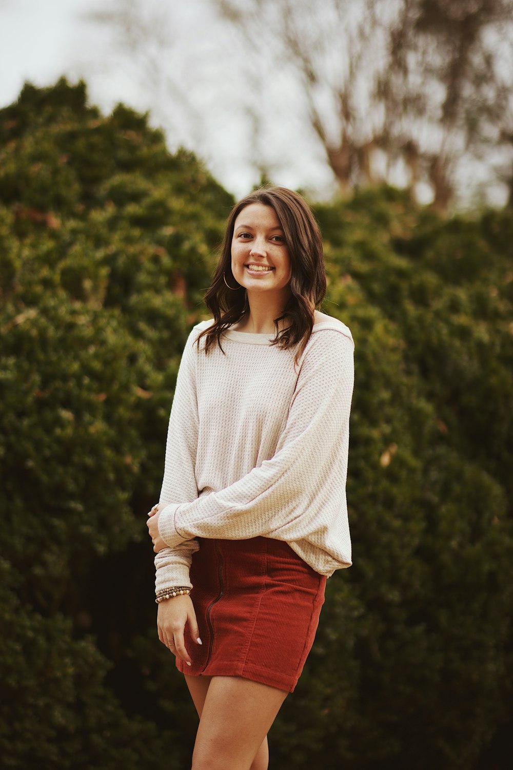 woman in white sweatshirt smiling