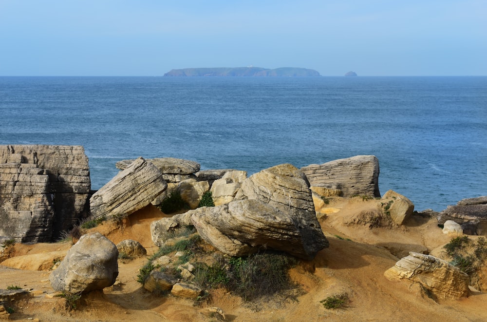 gray rock formation near water