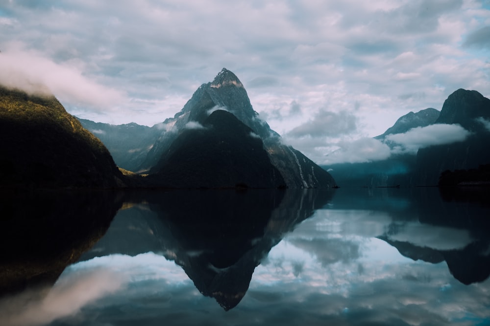 mountain reflection on body of water