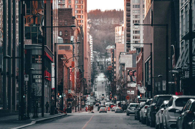 The old stone facades and narrow streets of Old Montreal in warm afternoon light