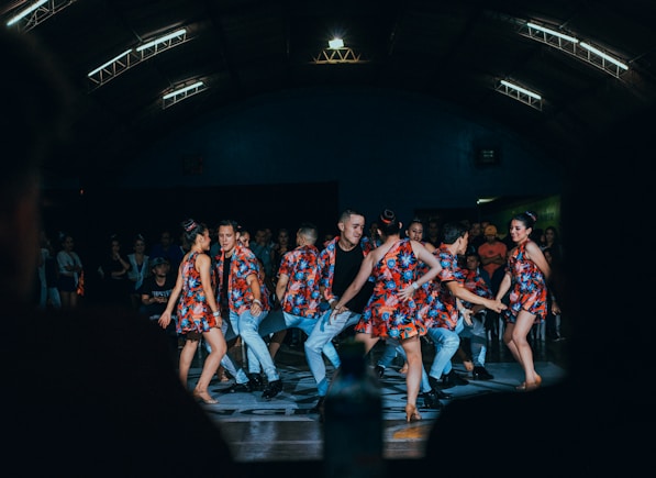 men and women dancing on stage