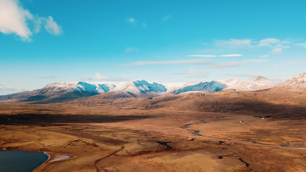 snow covered mountain under clear blue sky