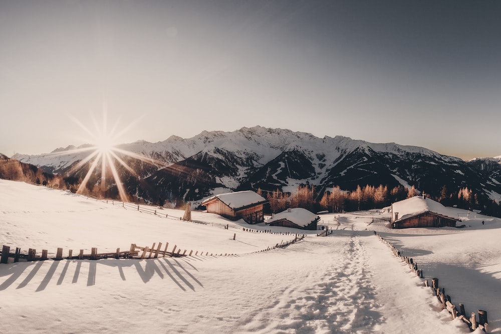 houses near mountain with snow