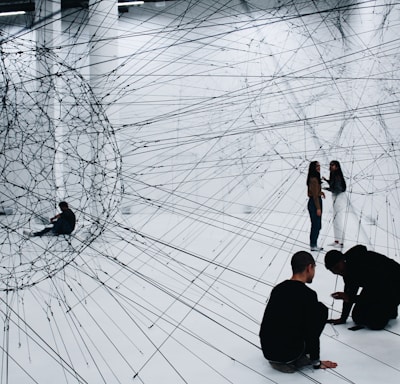 group of people sitting on floor