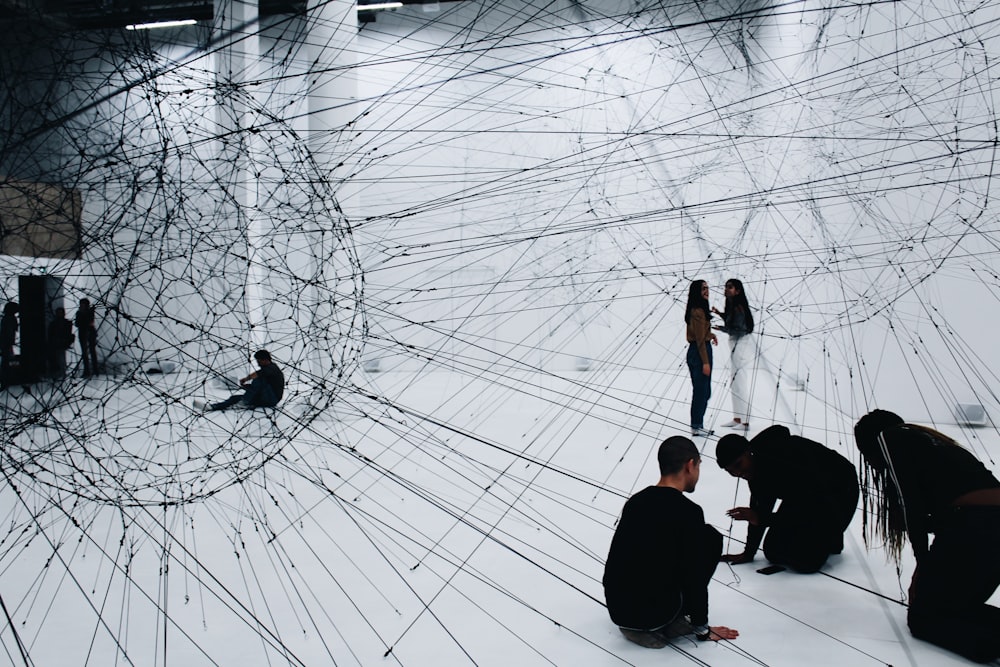 group of people sitting on floor