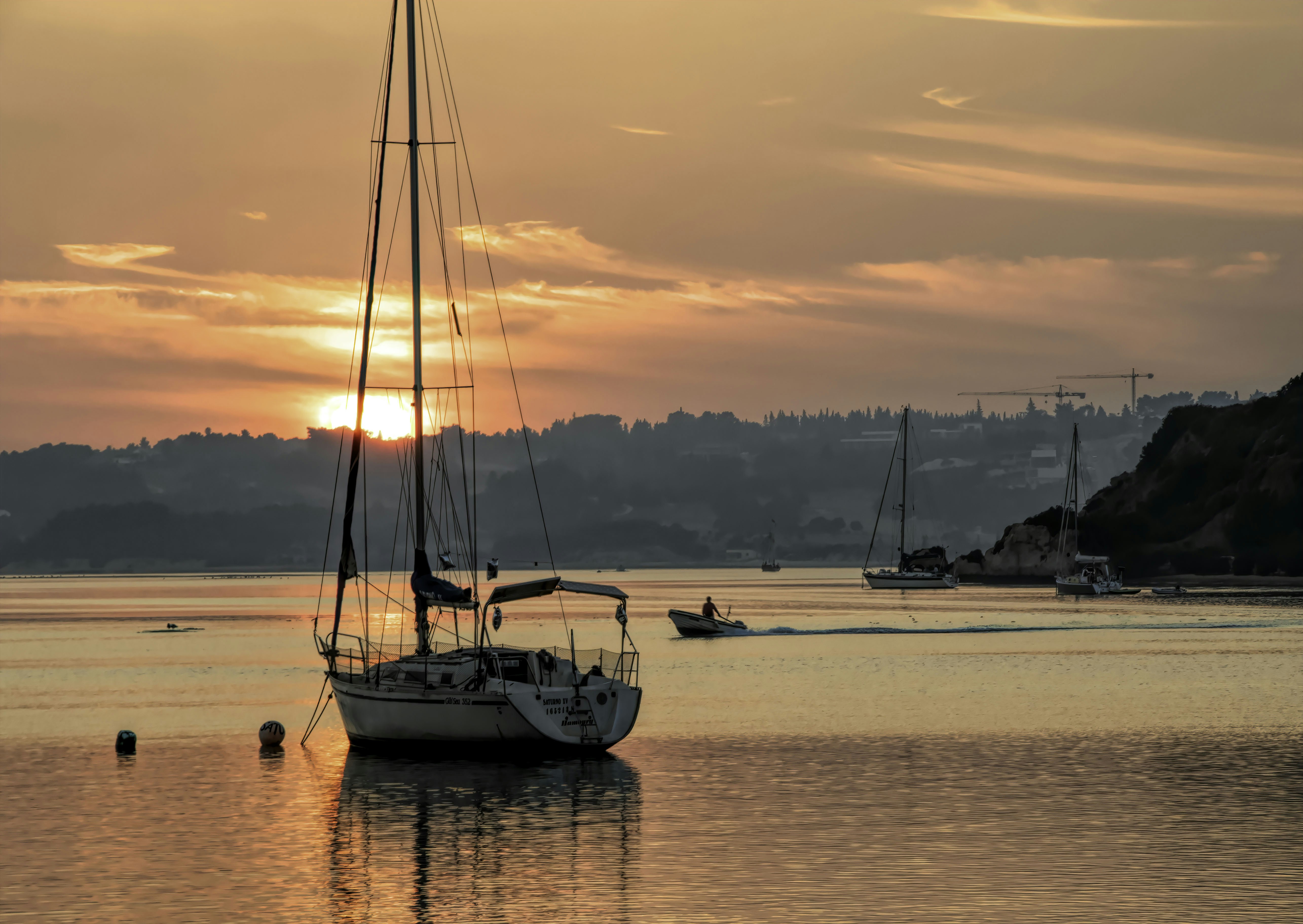 person showing yacht, Alvor sunset