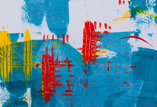 An abstract painting features bold and vivid brushstrokes. Shades of blue create a textured background, overlaid with vibrant red vertical patterns resembling wire or grid structures. Yellow streaks add contrast and dynamic energy to the composition.