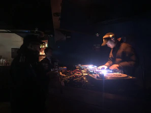 An intimate moment of a DJ mixing tracks during a night event in Vitacura