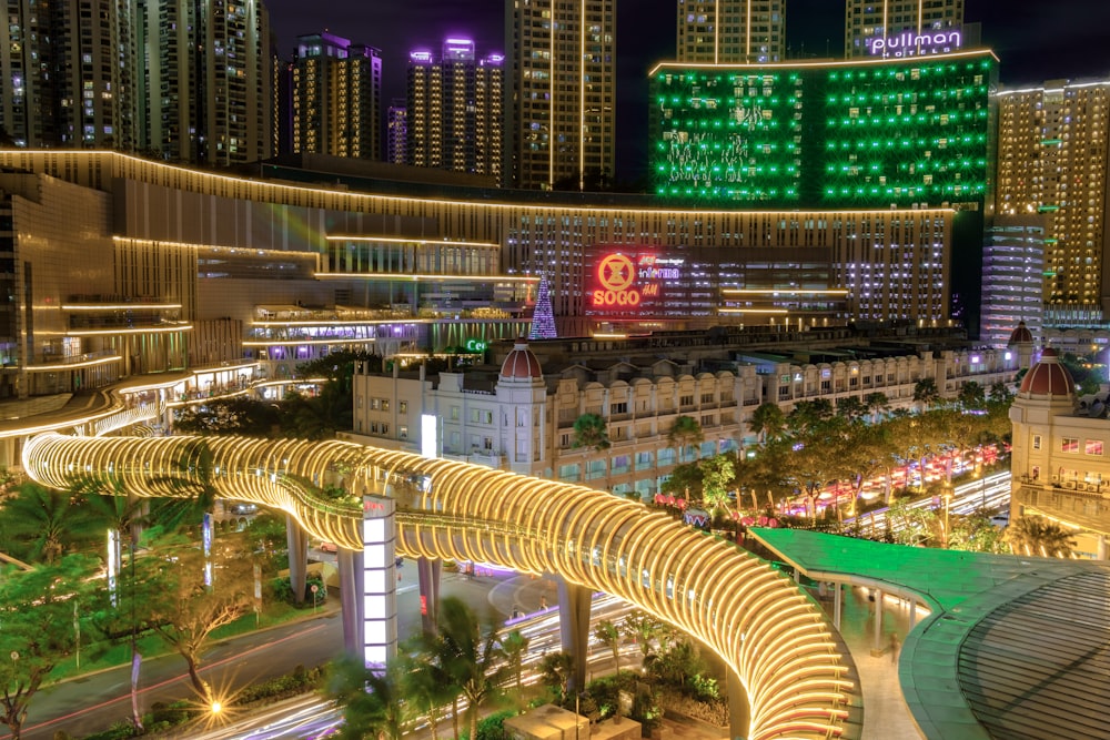 building with gold tunnel bridge during night