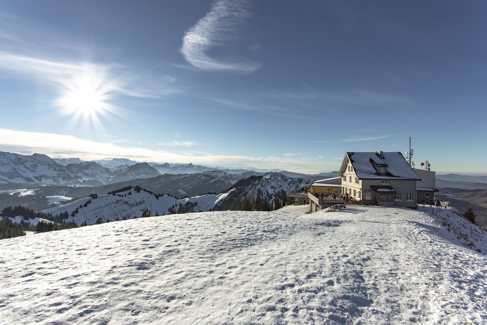 house on snow covered field during day