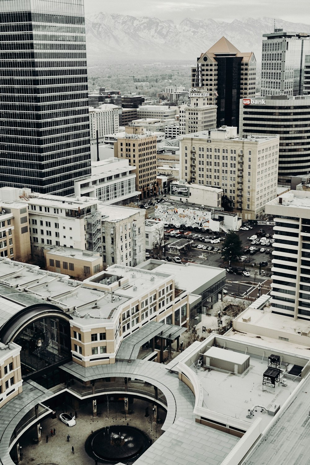 parked cars in the middle of city with high rise buildings