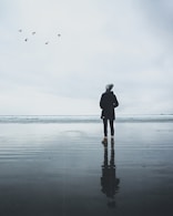 person standing on body of water