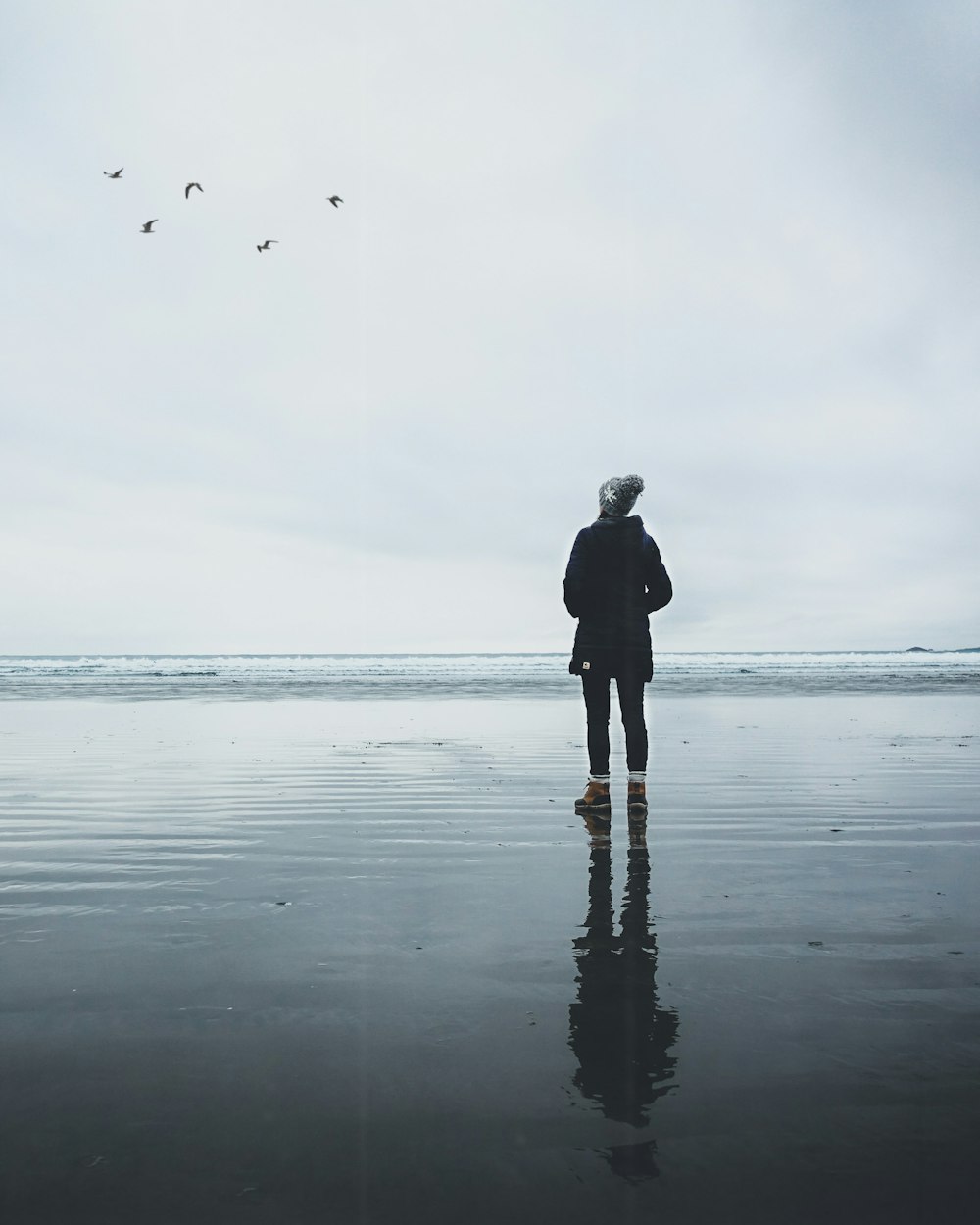 person standing on body of water