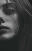 Close-up of a perfectly blended skin fade under dramatic lighting.