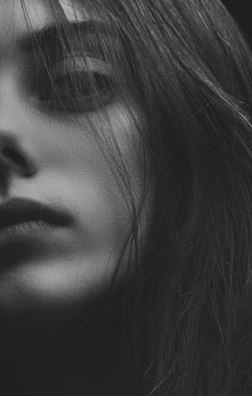Close-up of a perfectly blended skin fade under dramatic lighting.