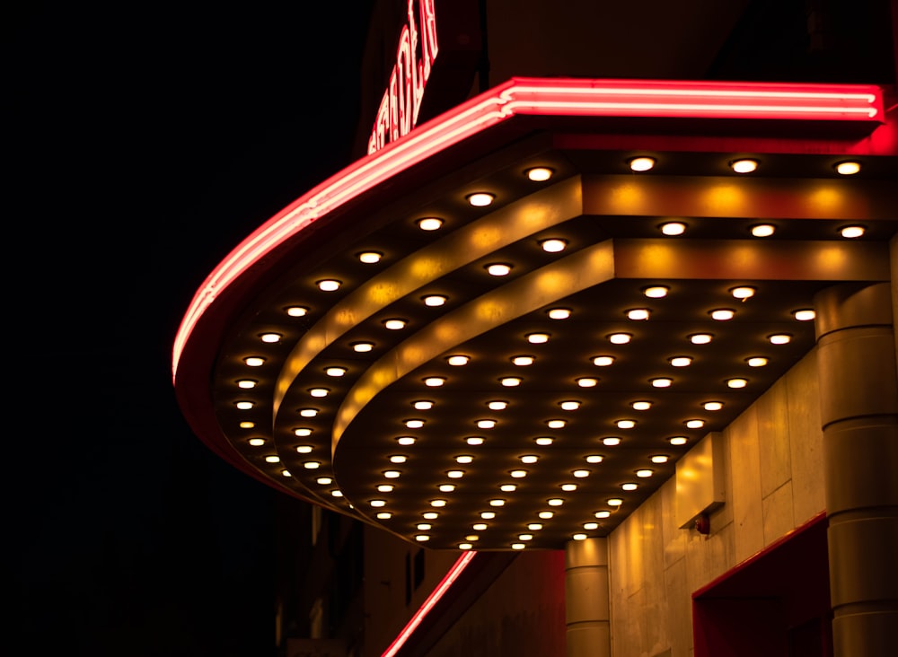 a building with a sign lit up at night