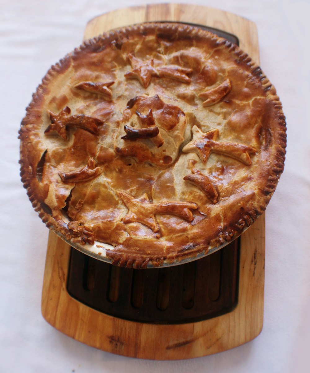 pie on brown wood slab