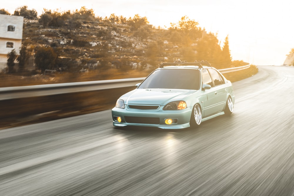 timelapse photography of blue Honda Civic on road