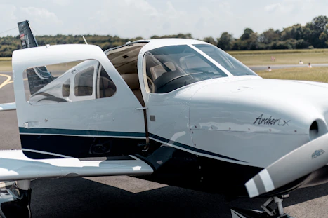 white Airplane on runway at daytime