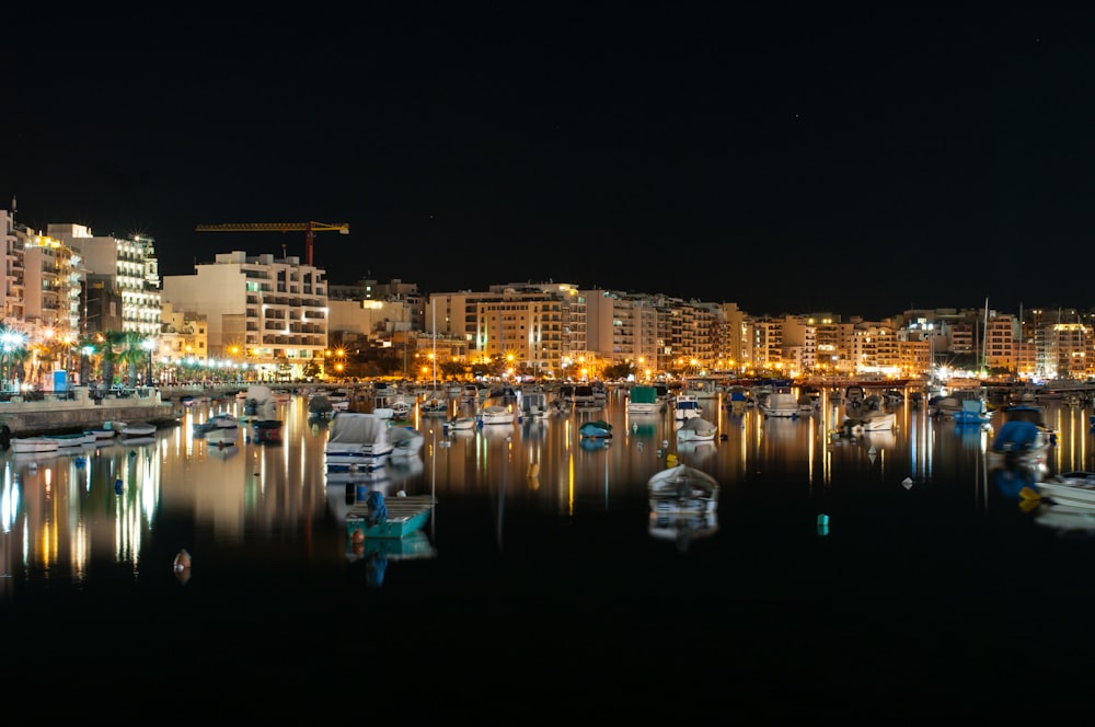 boats in body of water near buildings