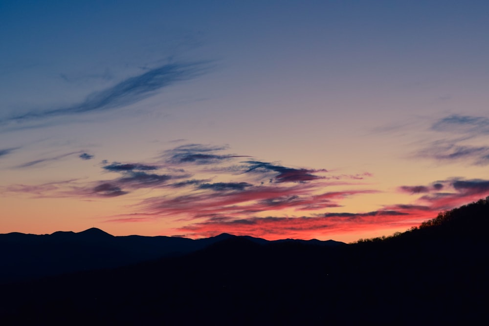 silhouette of mountain during golden hour