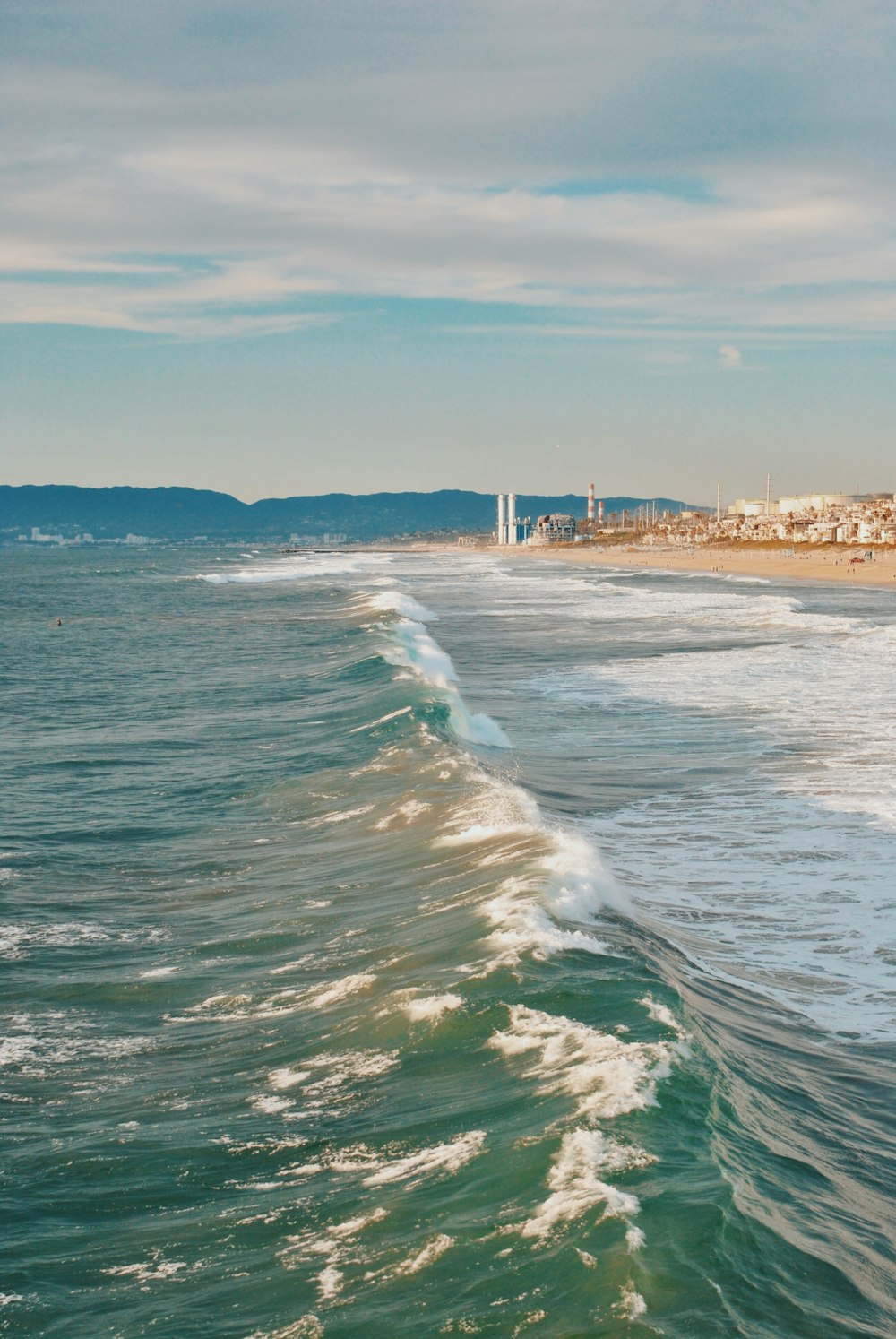 beach wave under nimbus clouds