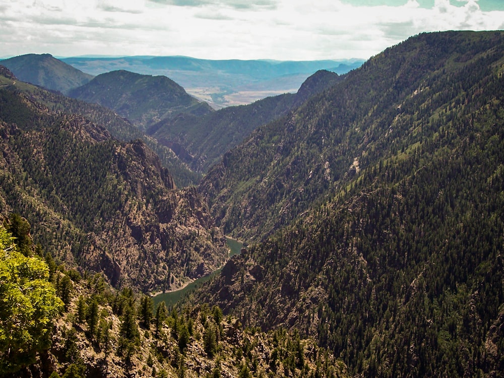 a view of a valley surrounded by mountains