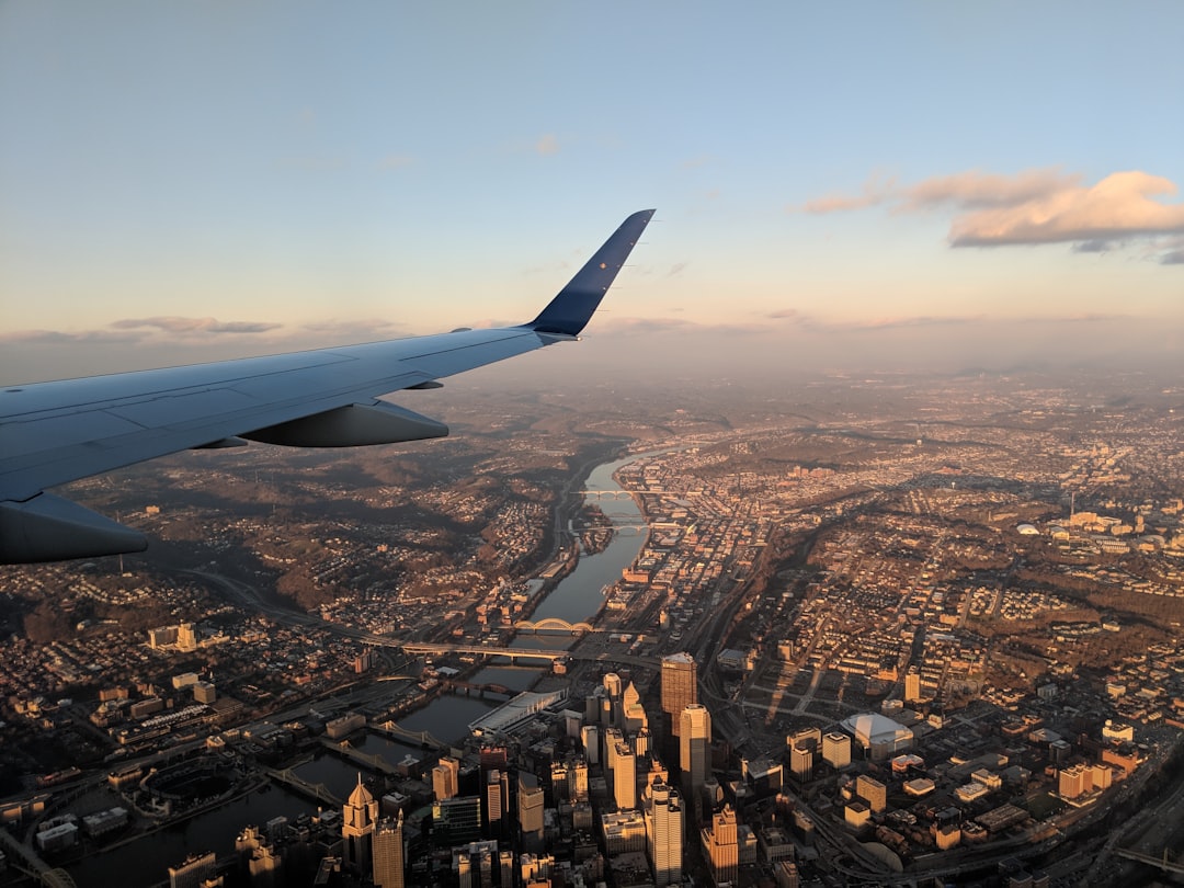 aerial view of body of water between buildings,