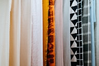 A variety of pleated screen colors displayed in a showroom.