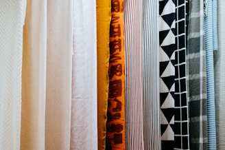 A variety of pleated screen colors displayed in a showroom.