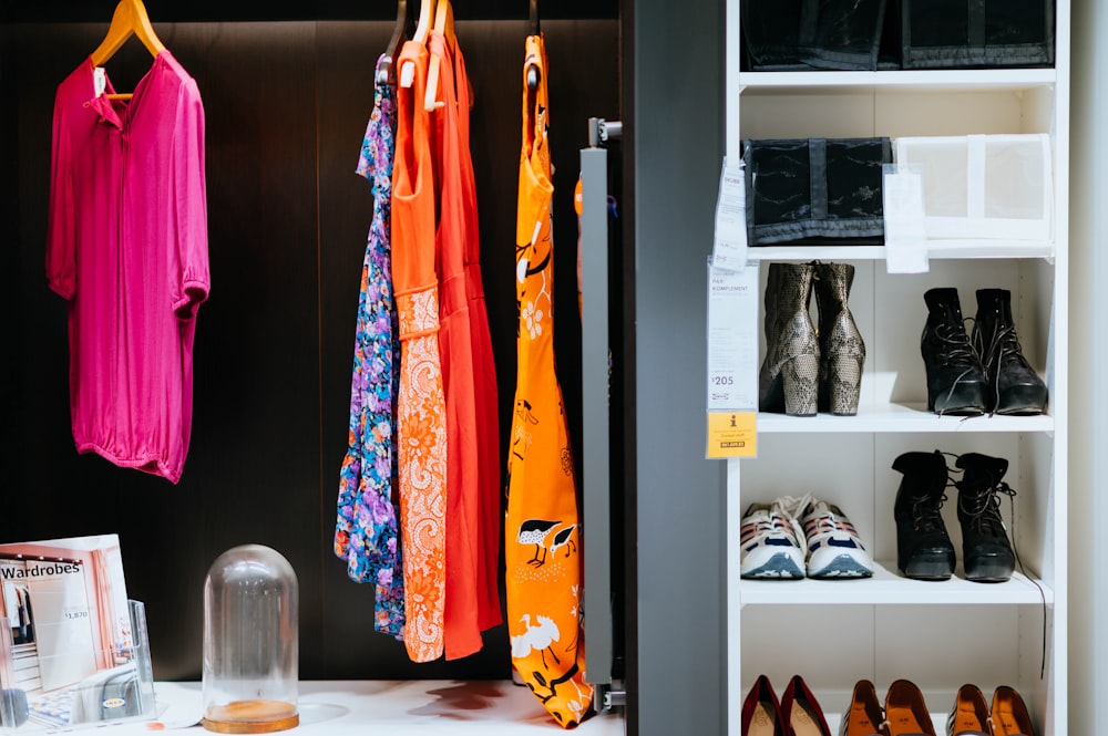 several women's tops inside cabinet