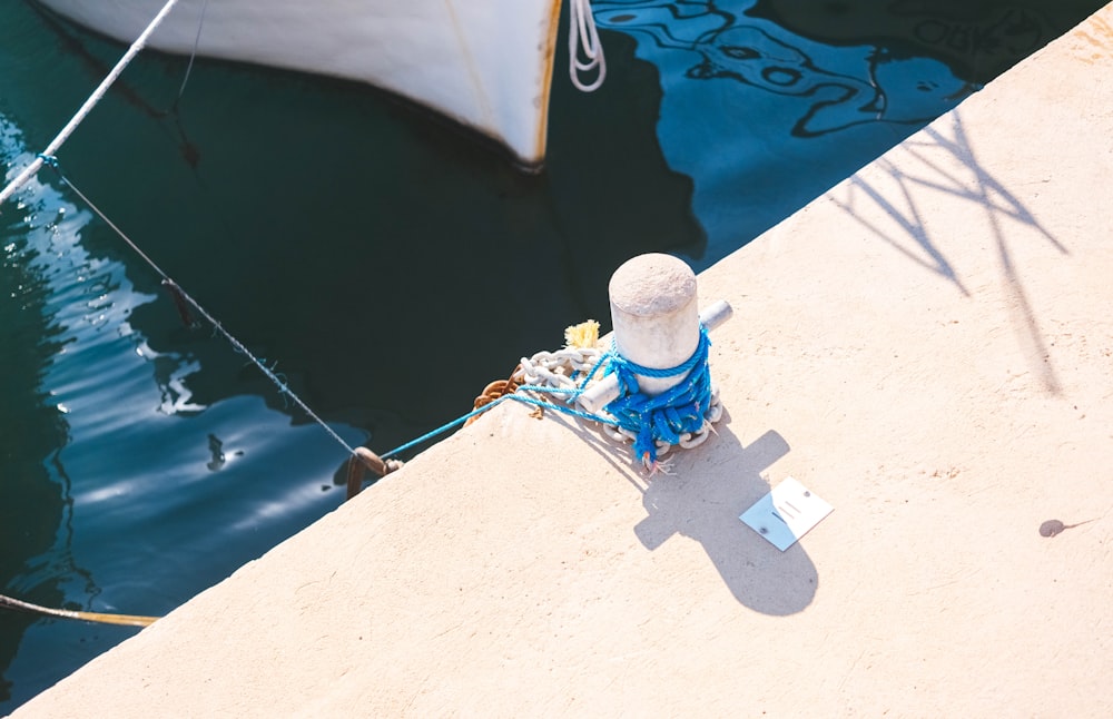 blue rope near body of water