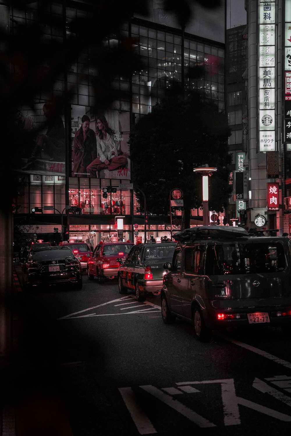 cars parked near building during nighttime