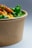 A close-up of a fresh green salad bowl with vibrant vegetables.